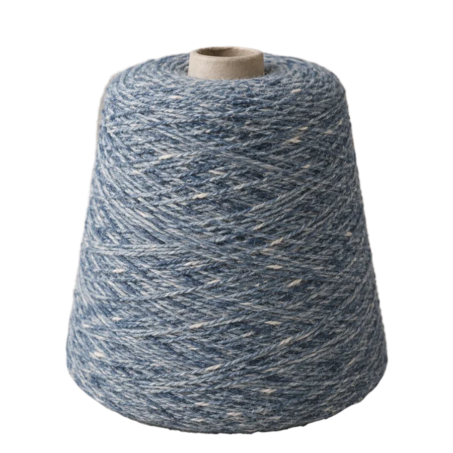 A cone of mottled light-indigo recycled yarn.